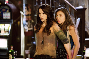 WYNONNA EARP -- "Keep the Home Fires Burning" Episode 102 -- Pictured: (l-r) Melanie Scrofano as Wynonna Earp, Dominique Provost-Chalkley as Waverly Earp -- (Photo by: Michelle Faye/Syfy/Wynonna Earp Productions)